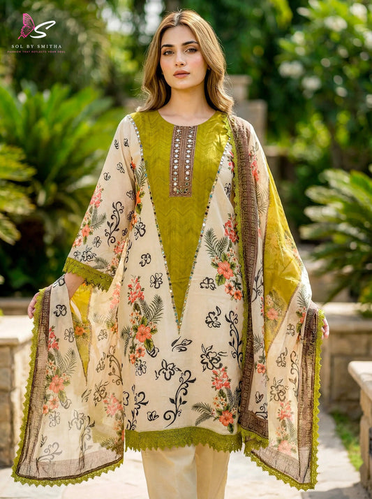 Woman wearing a cream and green floral printed silk kurta with embroidered neckline outdoors