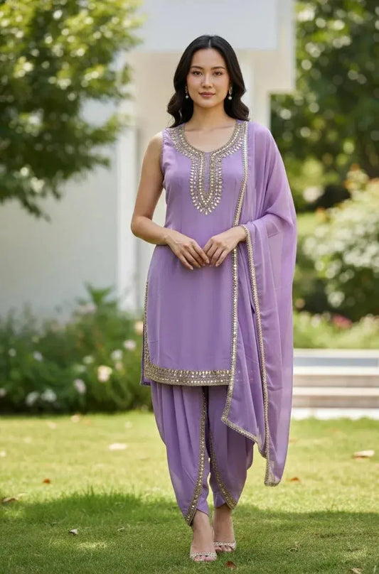 Woman wearing lilac embroidered Punjabi salwar kameez suit with dupatta outdoors