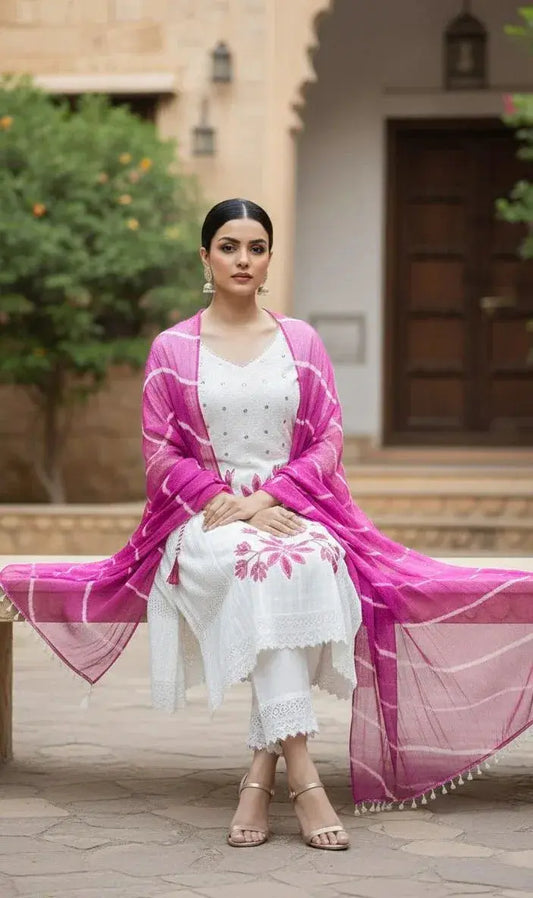 Woman in white embroidered kurta with pink dupatta, ethnic festive wear, outdoor setting