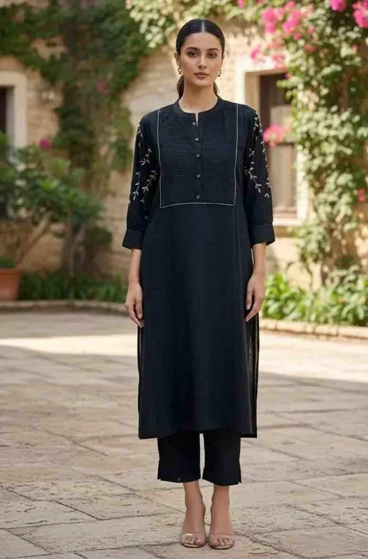 Black coord set by SOL BY SMITHA featuring a fitted top and matching pants, perfect for casual or stylish everyday wear.