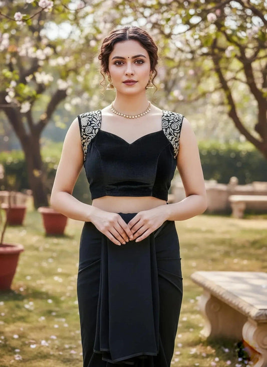 Black cut blouse by SOL BY SMITHA featuring stylish cut-out details and a fitted design, showcased on a white background.