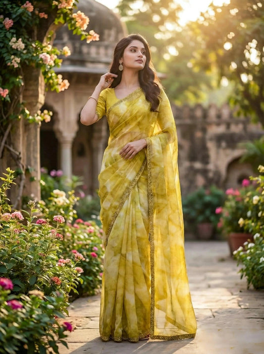 Golden saree from SOL BY SMITHA featuring intricate embroidery and a traditional drape, perfect for festive occasions.