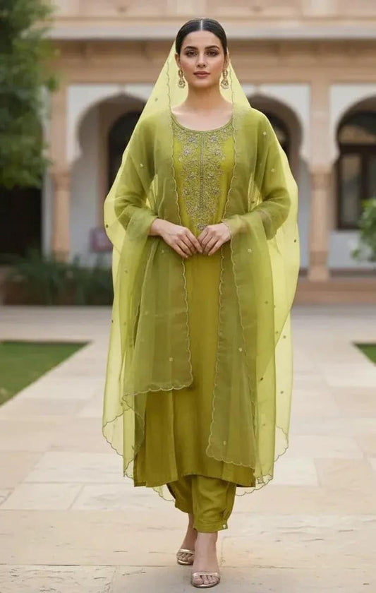 Green churidar set by SOL BY SMITHA, 3-piece suit with matching kurta, churidar, and dupatta displayed.