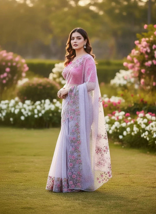 Lavender net saree by SOL BY SMITHA featuring intricate embroidery and sheer net fabric, draped elegantly.