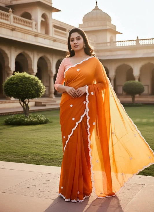 Orange hand-embellished saree with white bead work from SOL BY SMITHA, perfect for festive and special occasions.