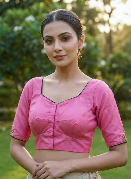 Pink SOL BY SMITHA blouse with long sleeves and a relaxed fit, displayed on a hanger.