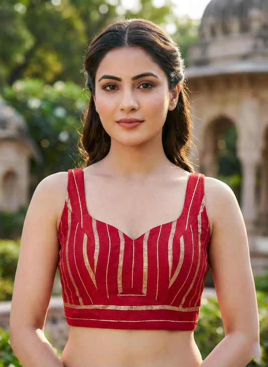 Red sleeveless blouse from SOL BY SMITHA, featuring a stylish design and lightweight fabric, perfect for casual or semi-formal wear.