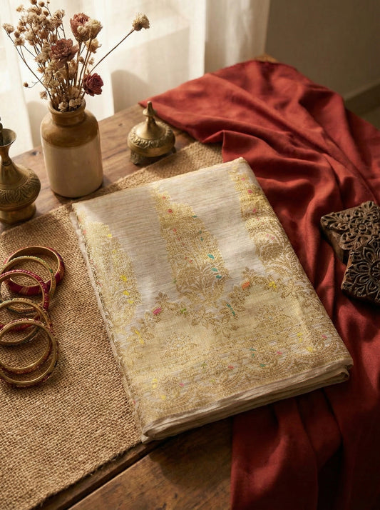 Open book with floral patterns on a wooden table with decorative items
