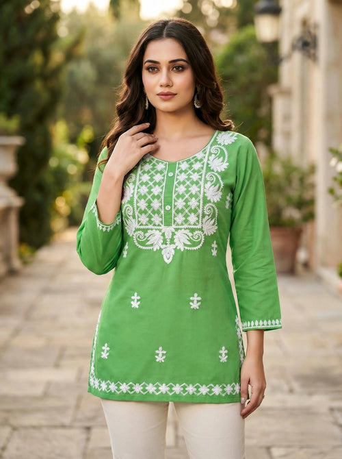 Woman in green kurta with white floral embroidery, outdoor ethnic wear fashion