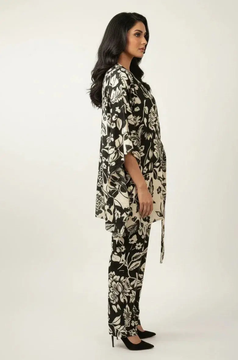Woman wearing black and white floral printed ethnic tunic and pants set