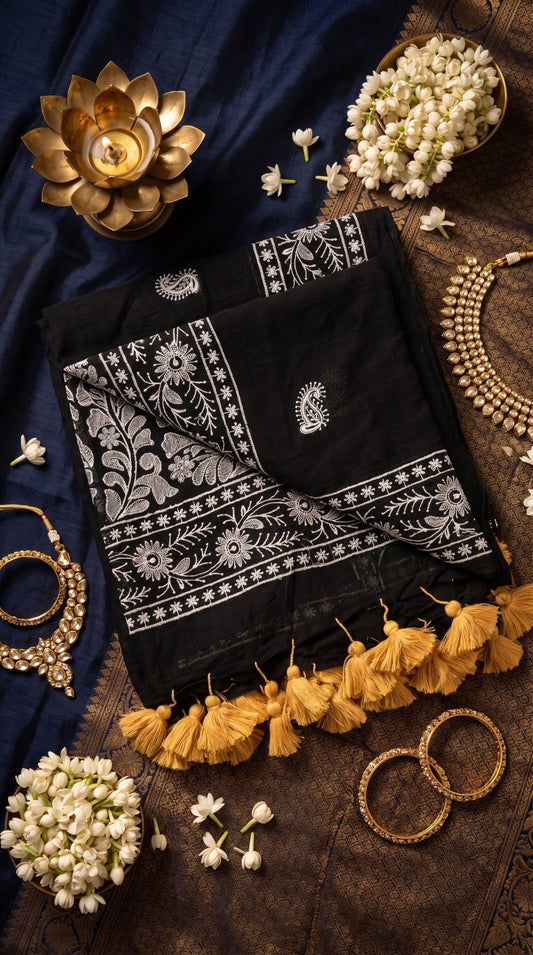 Traditional white Chikankari machine-embroidered Mull cotton saree for women by SOL BY SMITHA, showcasing intricate hand-like embroidery.