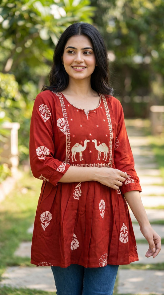 Cotton short kurti by SOL BY SMITHA featuring a comfortable design and intricate patterns, ideal for casual wear.