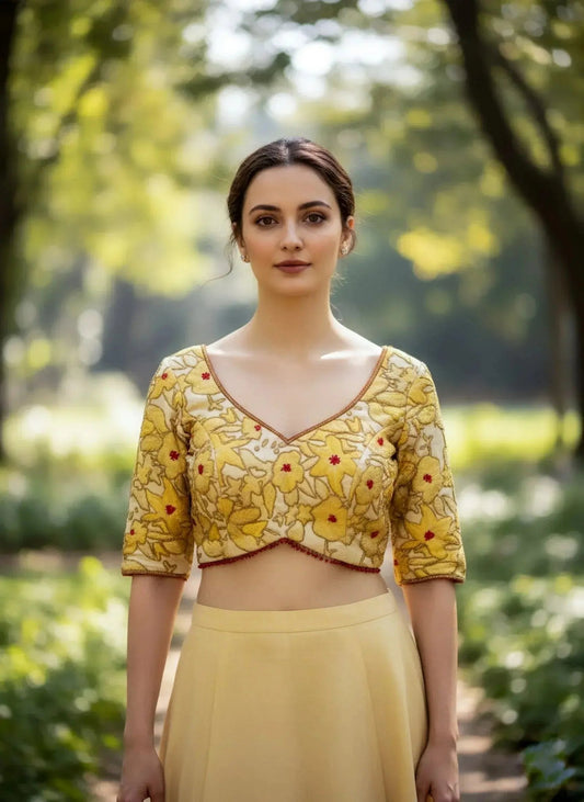 Golden floral embroidery saree blouse with elbow sleeves by Sol By Smitha Dubai