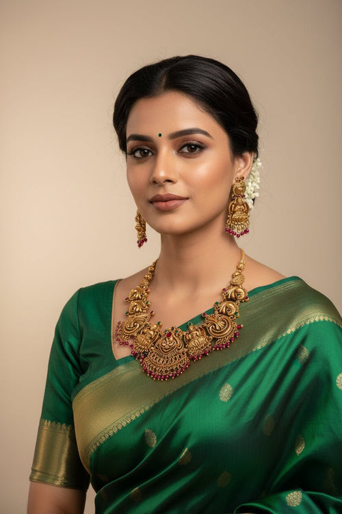 Heavy Lakshmi set earrings by SOL by Smitha featuring mango green, red, and white drops with intricate design.