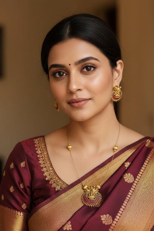 Invisible Nagalakshmi green and red pendant necklace by SOL BY SMITHA with intricate design visible on a white background.